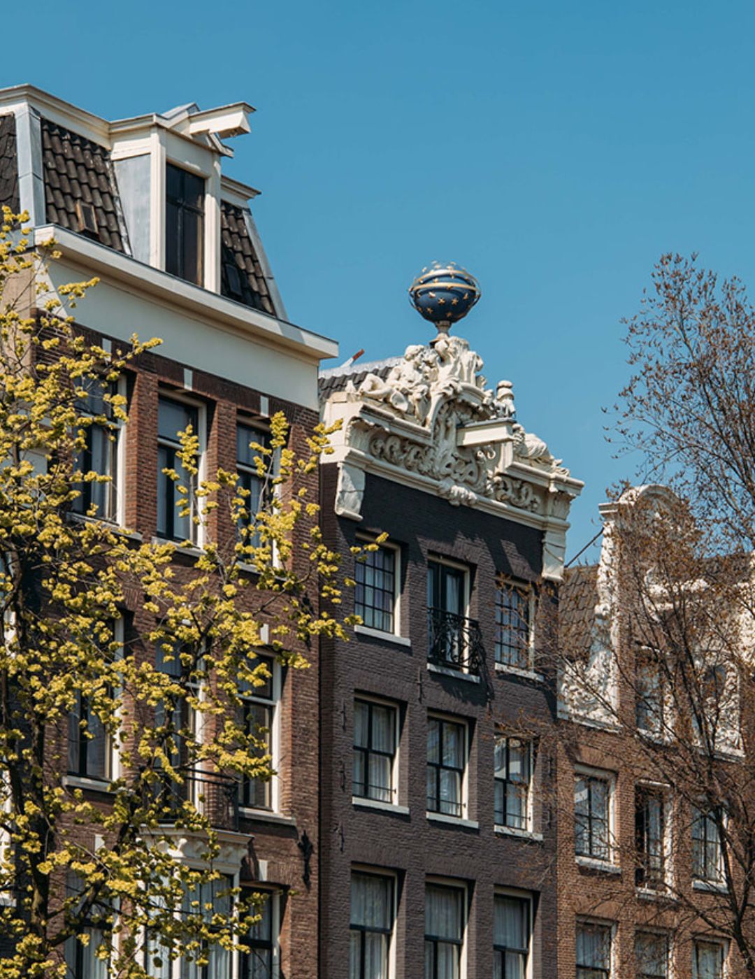 Historic canal houses of the ambassade hotel in amsterdam, part of the unesco world heritage-listed canal ring.
