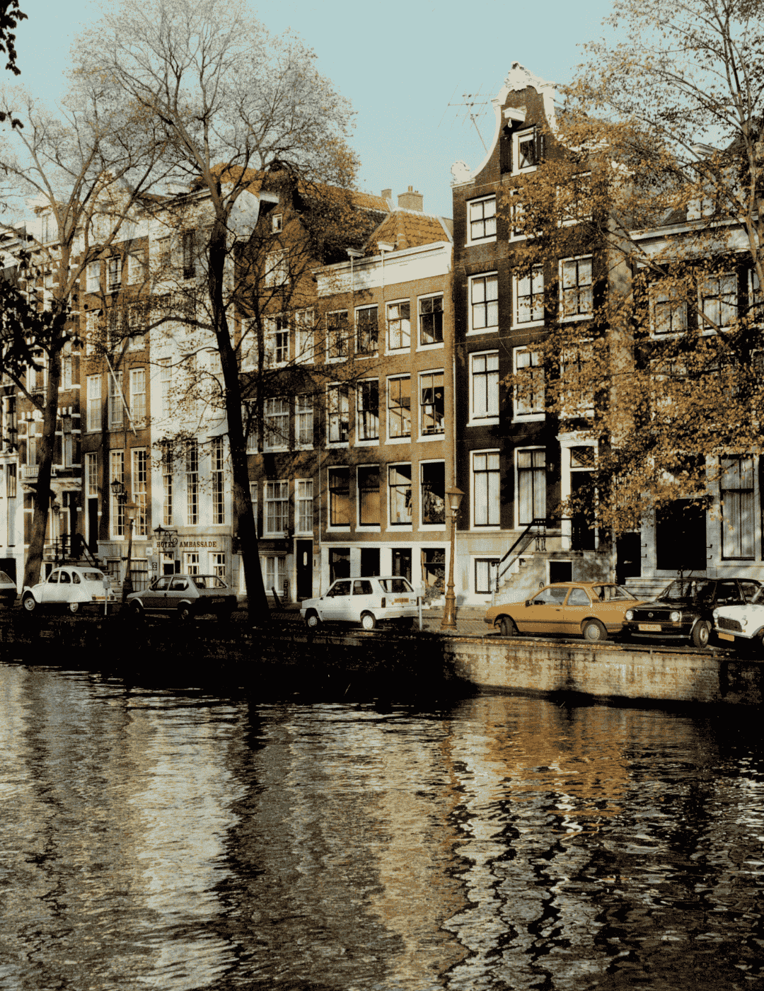 Vintage photo of historic canal houses lined up along the herengracht in amsterdam.