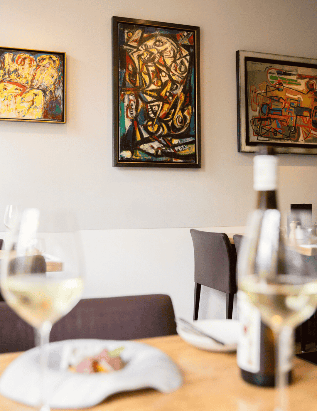 The alechinsky lounge at the ambassade hotel featuring cobra artworks in a refined setting.