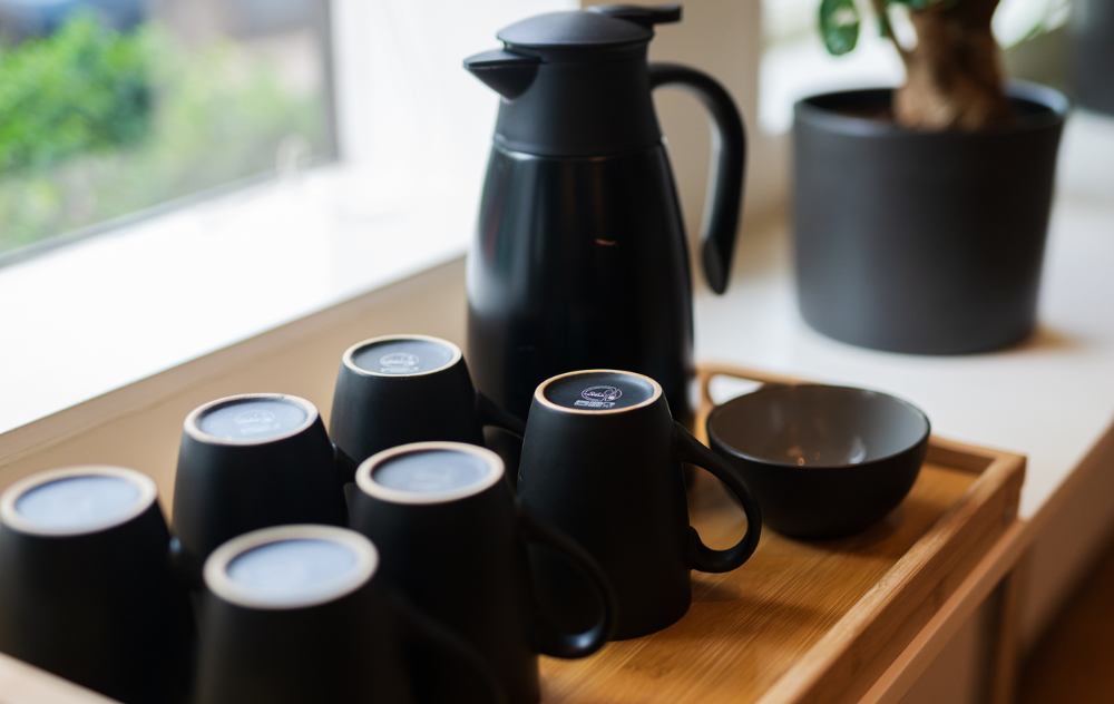 Guest being welcomed with tea at koan float in the ambassade hotel, setting a calm and relaxing atmosphere.