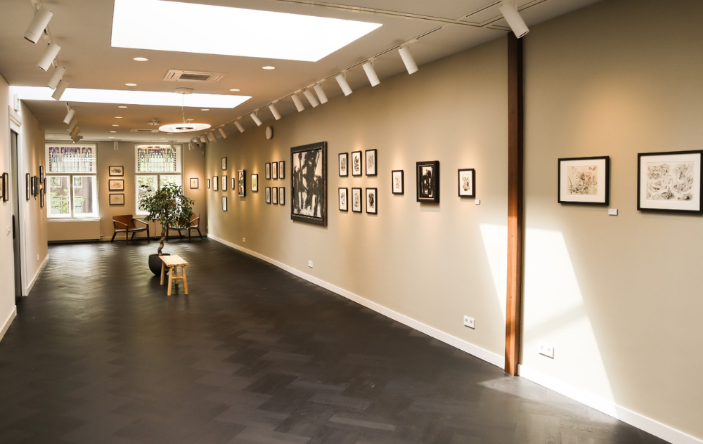 Wolvecamp exhibition at the ambassade art gallery in amsterdam, showcasing expressive abstract artworks in an elegant gallery space.