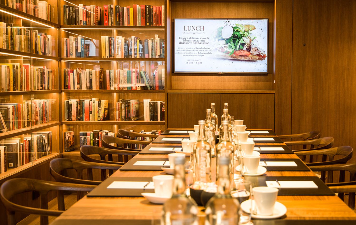 Presentation setup in the library bar at the ambassade hotel, surrounded by books and art.