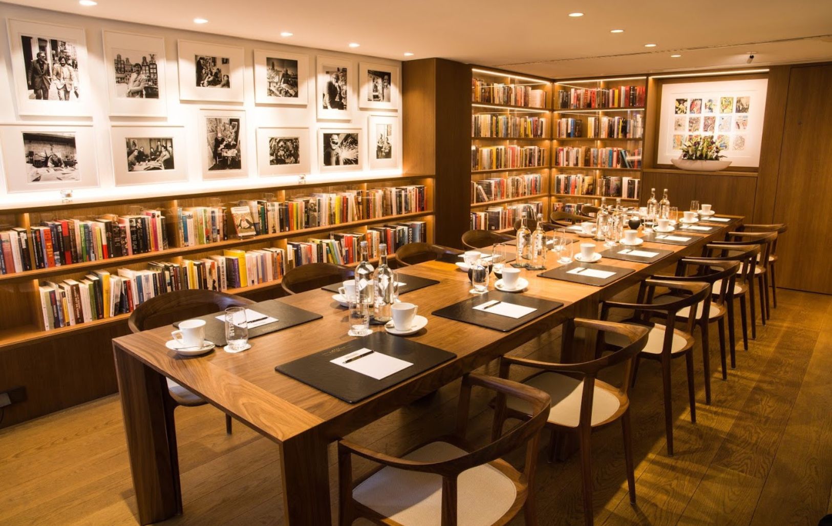 Business meeting setup in the library at the ambassade hotel, surrounded by books and classic decor.