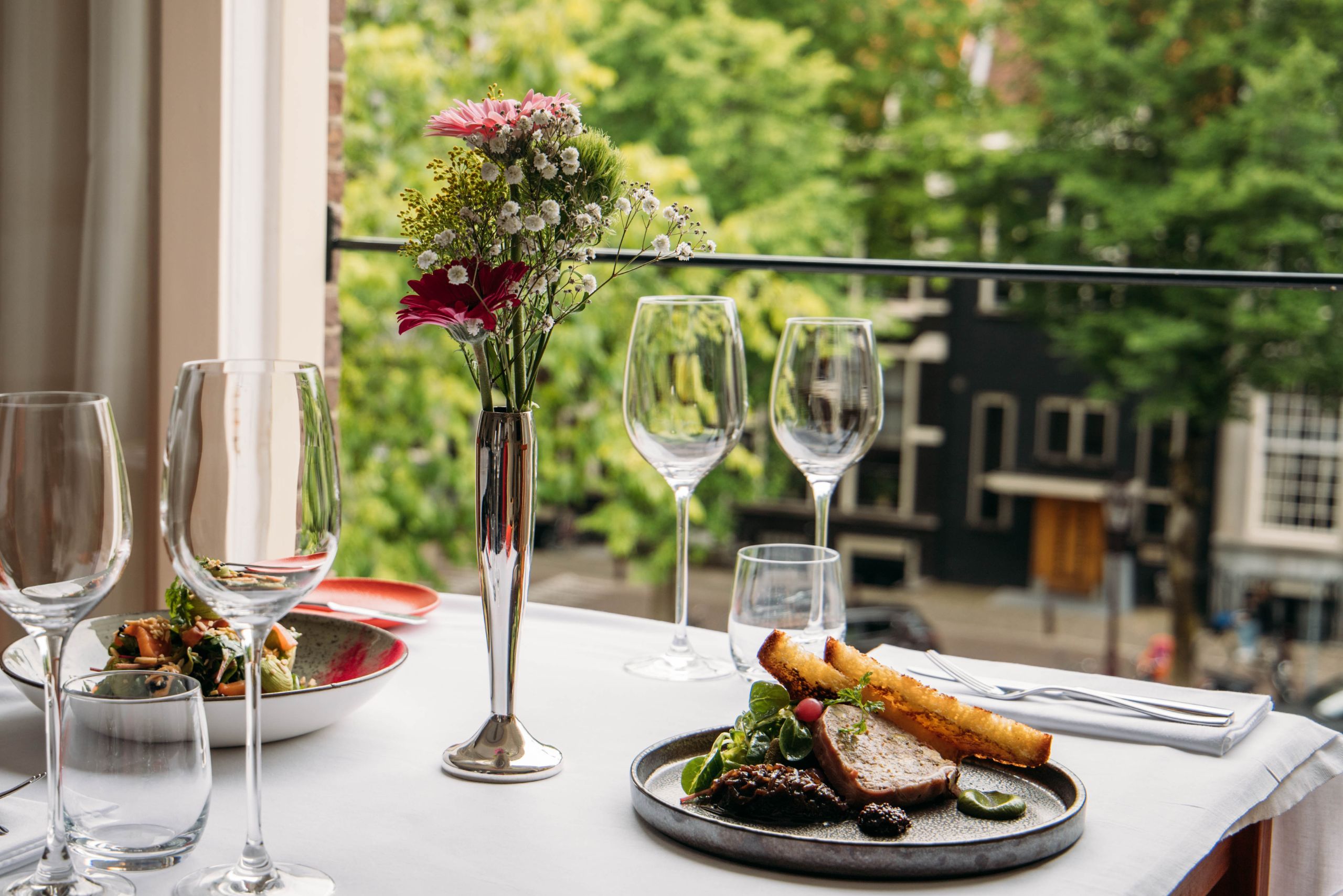 Dining with a view of the canal at the ambassade hotel.