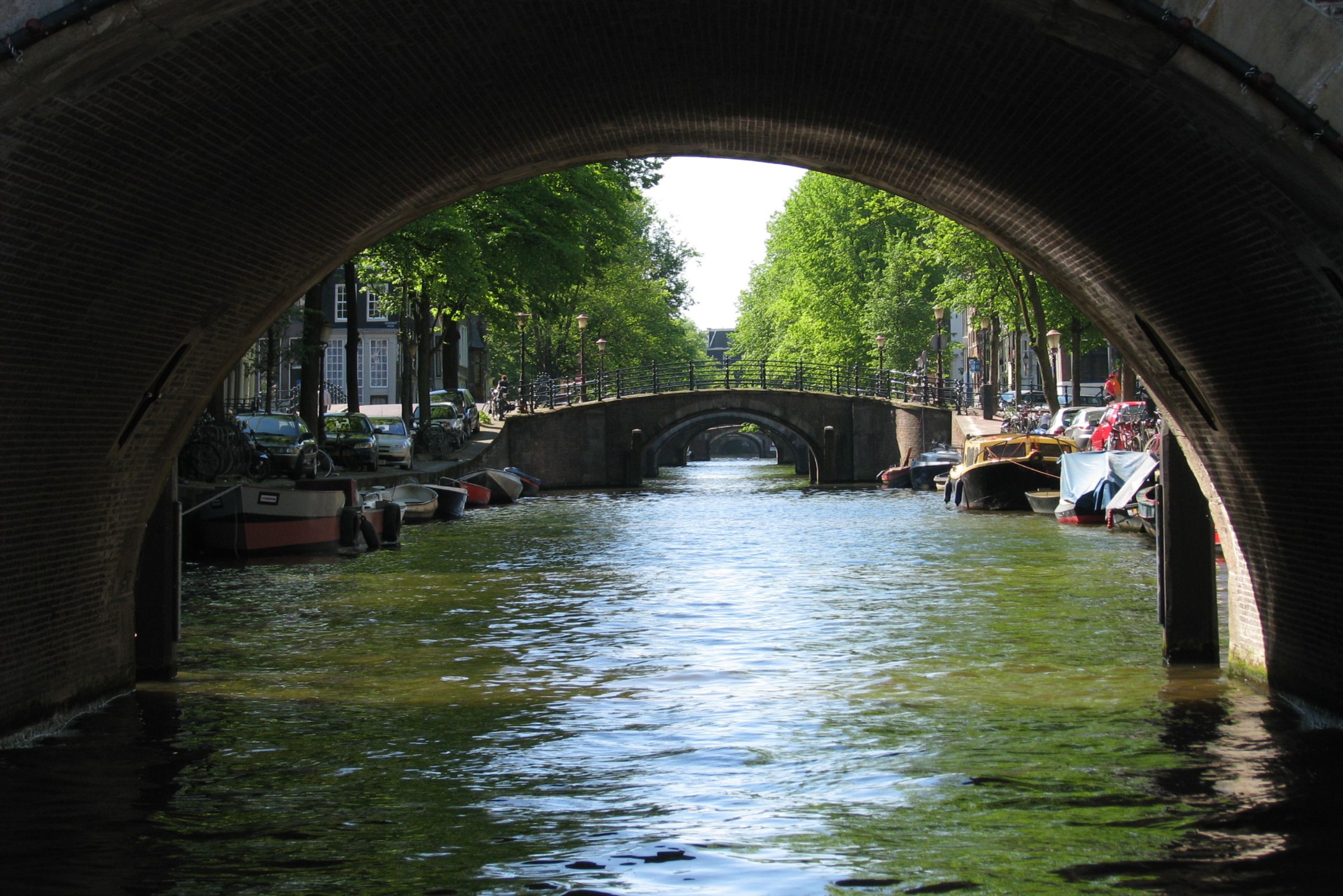 View of amsterdam’s famous seven bridges from a canal boat, one of the city’s most iconic and scenic sights.