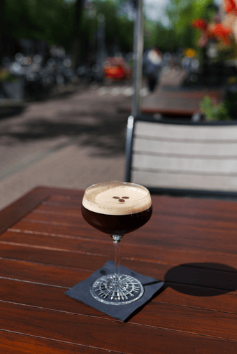 Espresso martini served on the outdoor terrace of the ambassade hotel.