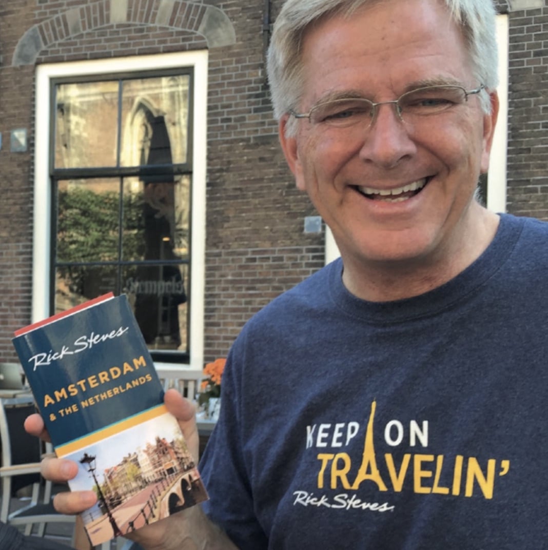 Travel writer rick steves during his stay at ambassade hotel, sharing insights on cultural immersion and mindful travel.